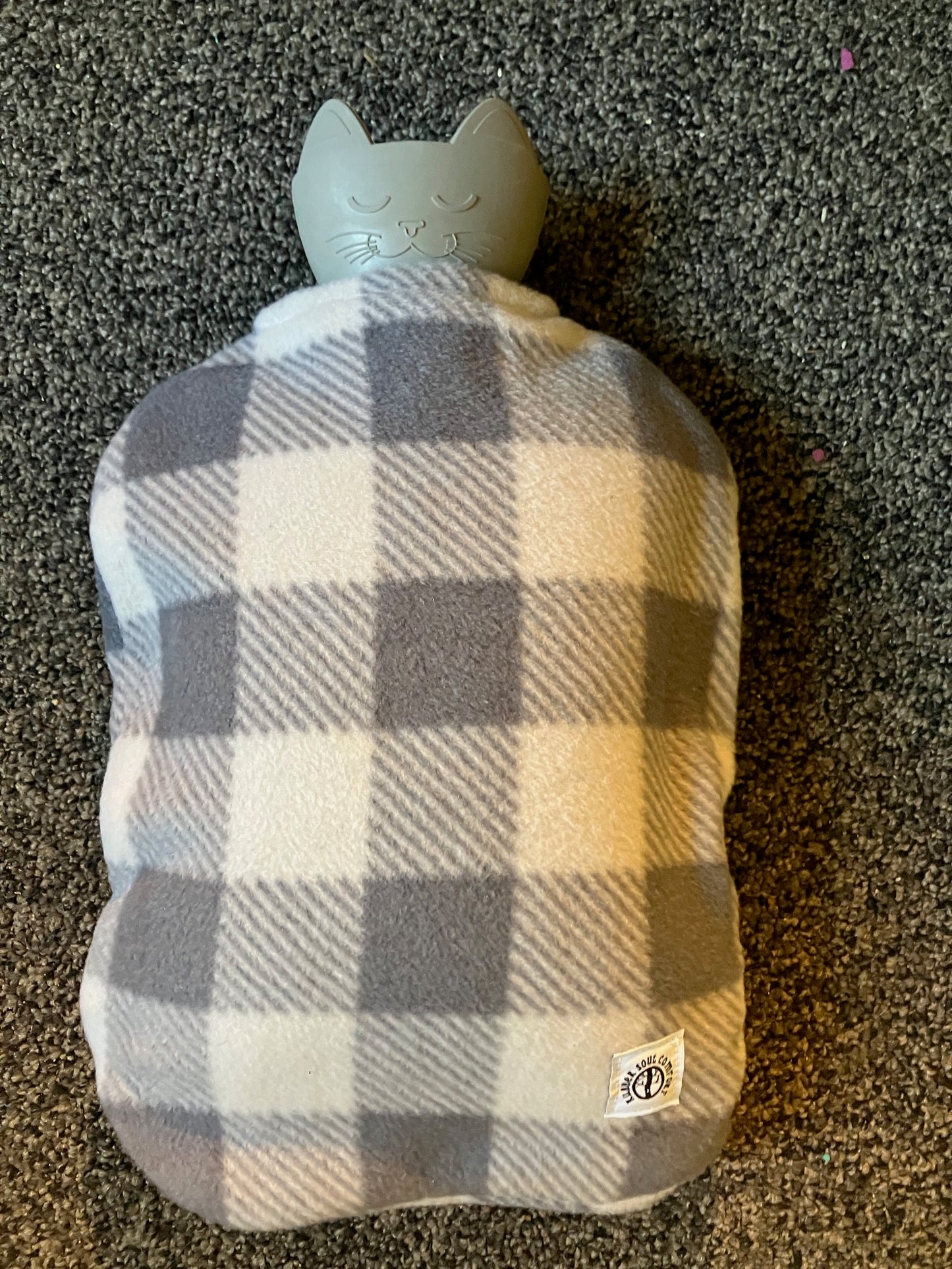 Bottle with grey plaid cover